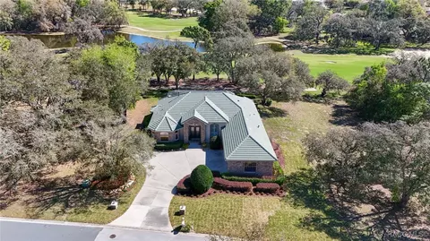 Aerial view of home, water, and fairway